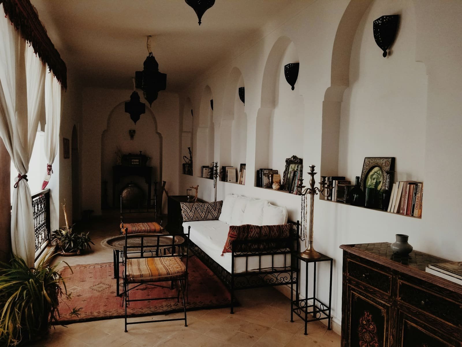 Furnished riad room with lanterns and traditional furniture