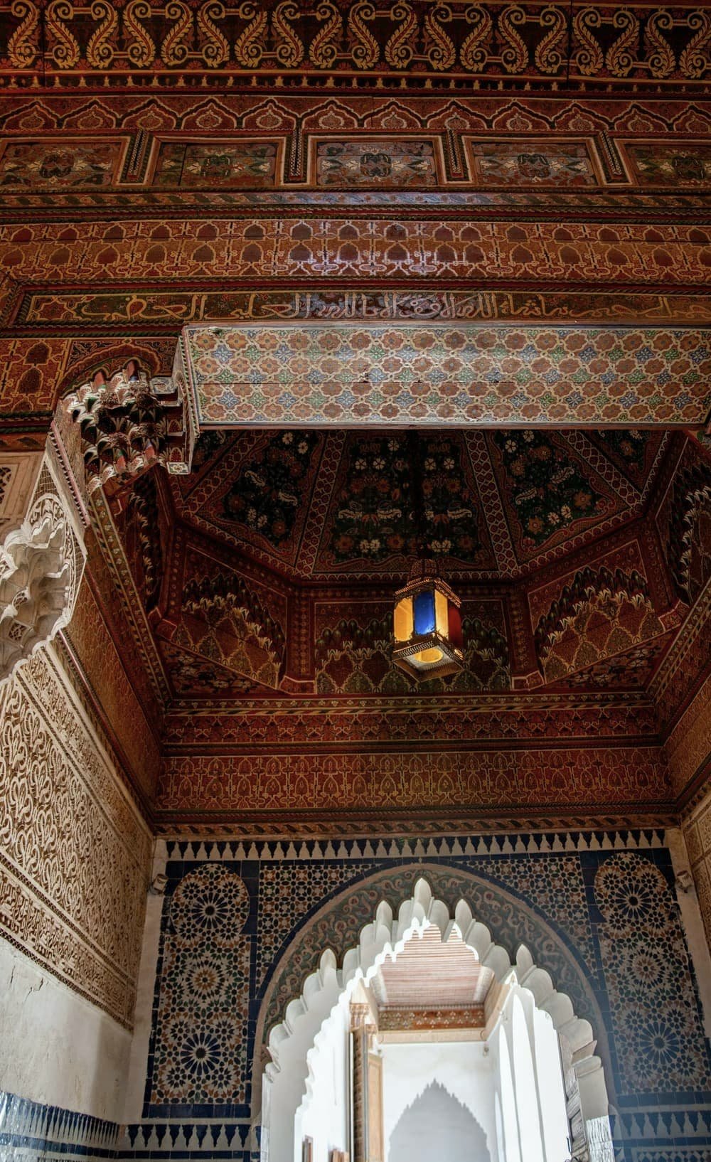 Painted and carved wooden ceiling above an arch